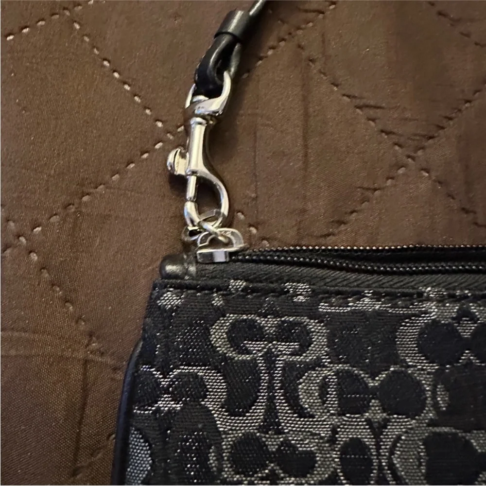 Coach Monogram Wristlet in Black silver with Metallic Elements and leather strap